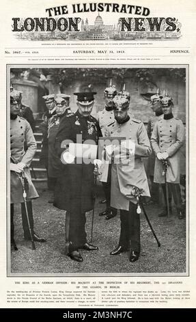 George V appearing in uniform at an inspection of his regiment, the 1st Dragoons of the Guards, in Berlin together with Kaiser Wilhelm II during a visit to Germany in 1913 for the wedding of the Kaiser's only daughter, Princess Victoria Louise.  George was honorary colonel of the regiment. The two cousins are looking at photographs of previous festivities in connection with the wedding.   This picture was taken less than a year and a half before England declared war on Germany in August 1914.     Date: 1913 Stock Photo