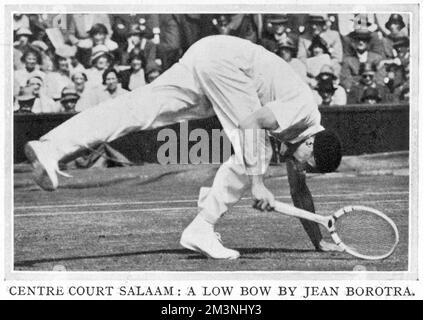 Jean Borotra (1898-1994), French tennis player known as the 'Bounding Basque', pictured here in action during a match on the Wimbledon Centre Court in 1932 wearing his signature beret.     Date: 1932 Stock Photo
