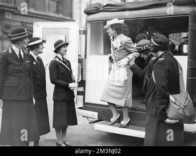 Princess Alice, Duchess of Gloucester (1901 - 2004) inspecting a mobile canteen presented to the British Red Cross and Order of St. John County Committee of Gloucestershire by the Benedict Bureau Unit through the British War Relief Society of America at Cirencester.       Date: c. 1940 Stock Photo