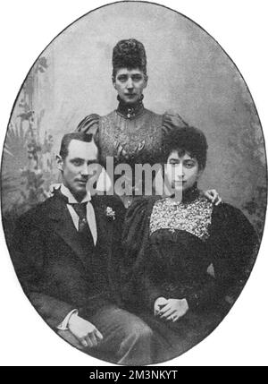 Prince Charles (or Carl) of Denmark, later King Haakon VII, King of Norway, and Princess Maud of Wales (1869-1938), youngest daughter of Edward VII and Queen Alexandra (the latter is standing behind them).  Photographed at the time of their marriage in 1896 -- the wedding took place on 22 July in the private chapel of Buckingham Palace.  They were first cousins.       Date: July 1896 Stock Photo