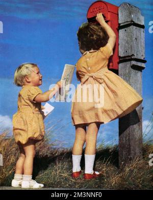 Children posting a letter Stock Photo