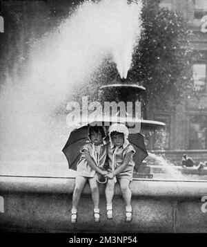 Cooling off in Trafalgar Square Stock Photo