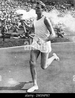 John Mark carrying the Olympic torch, opening ceremony, 1948 Stock Photo