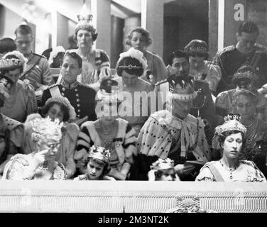 Scene at the Coronation of King George VI in Westminster Abbey on 12 May 1937.  Showing, from left to right in the front row, Queen Mary, Princess Elizabeth (later Queen Elizabeth II), Princess Margaret, and Princess Mary (Princess Royal, Countess of Harewood).      Date: 1937 Stock Photo