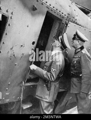 Hitler inspects a train wrecked by Poles, 1939 Stock Photo