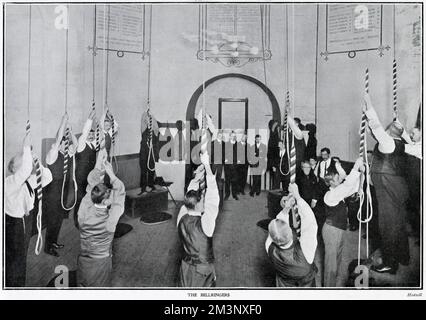 The interior of the ringing chamber at St Paul's Cathedral, London. The twelve bells of the north tower can be seen here, about to be rung by an all male band of ringers.     Date: 1903 Stock Photo