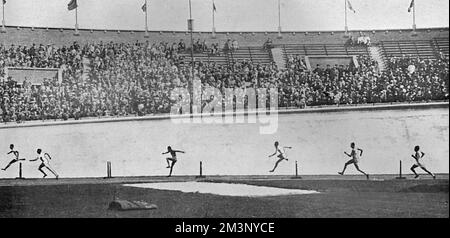 The final of the 400 metres hurdles at the 1928 Amsterdam Olympic Games, showing Lord Burghley silhouetted against the concrete banking of the stadium racing his way to a gold medal victory.  David George Brownlow Cecil, 6th Marquess of Exeter (1905 - 1981), Lord Burghley was an athlete, sports official and Conservative party politician.  As an athlete, Burghley was a very keen practitioner who placed matchboxes on hurdles and practised knocking over the matchboxes with his lead foot without touching the hurdle. In 1927, his final year at Magdalene College, Cambridge, he amazed colleagues by s Stock Photo