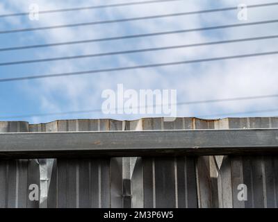 Metal sheet surface texture, Metal sheet Fence and sky Stock Photo