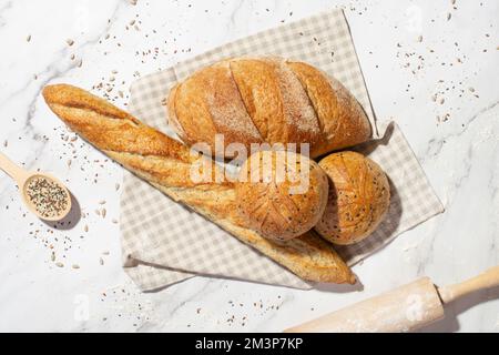 Background with different types of fresh bread. Bakery products. Cooking. Stock Photo