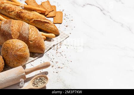 Background with different types of fresh bread. Bakery products. Cooking. Stock Photo