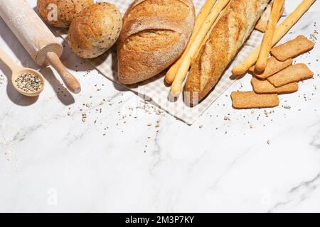 Background with different types of fresh bread. Bakery products. Cooking. Stock Photo
