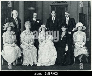 Members of the Royal Family at the christening of Princess Elizabeth (later Queen Elizabeth II);  (L to R) Standing - the Duke of Connaught, King George, the Duke of York and the Earl of Strathmore; (seated) Lady Elphinstone, Queen Mary, the Duchess of York with Princess Elizabeth the countess of Strathmore and Princess Mary.     Date: 29 May 1926 Stock Photo