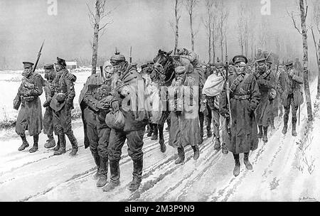 Winter conditions in the Yser country : how the cold is affecting friend and foe. German prisoners and British soldiers alike frozen in the icy winds and snow in winter 1914.     Date: 1914 Stock Photo