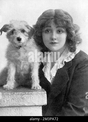 Miss Laurette Taylor (1883-1946) American actress born Loretta Helen Clooney. She appeared in one of the most popular shows of the First World War in London, Peg O' My Heart, written by her husband J Hartley Manners. Pictured with Michael, one of the canine stars of the show, who according to The Tatler went missing for a while but was soon returned.       Date: 1915 Stock Photo