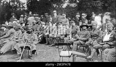 A scene at Mr Bernhard Barron's garden party which he gave at Hove to wounded soldiers in July 1915.  Several hundred of convalescent men who were recuperating in Brighton, including Indian soldiers - mainly Sikhs and Gurkhas - were entertained.  Mr Barron, owner of the Carreras Tobacco Company had generously given upwards of three million of the famous 'Black Cat' cigarettes to soldiers at the front.       Date: 1915 Stock Photo