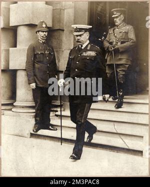 Horatio Herbert Kitchener, 1st Earl of Khartoum and Broome (1850-1916), going to face his critics as war minister: leaving the war office on 2nd June 1916, for his meeting with (about two hundred) Menbers of Parliament desirous of information it was not in the public interest to discuss publicly in the House of Commons.  Within a few hours of the unprecedented gathering, he had left London, with his personal staff, and was on his way to take ship for Russia on board the cruiser 'Hampshire'.  General Sir William Robertson (1860-1933) walking behind.  2nd June 1916 Stock Photo