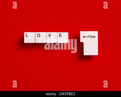 Online dating. To search and find love on the internet or social media applications concept. Computer keyboard keys with the word love. Stock Photo
