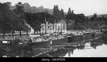 Hospital barges on part of the immense network of canals in France, providing a smooth and silent highway for wounded British soldiers on their way to hospital ships at ports bound for England.     Date: 1915 Stock Photo