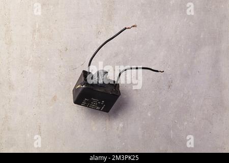 a faulty capacitor that must be replaced Stock Photo