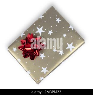 Golden gift box with red bow and star ornament isolated on white. Stock Photo