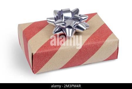 Craft gift box from brown paper with red stripes and silver bow isolated on white Stock Photo
