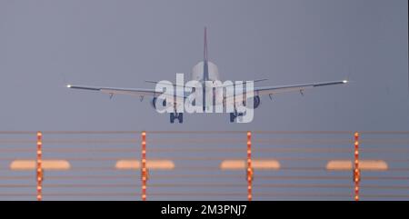 Hamburg, Germany. 16th Dec, 2022. A passenger plane lands at Hamburg Airport in the afternoon. Credit: Marcus Brandt/dpa/Alamy Live News Stock Photo