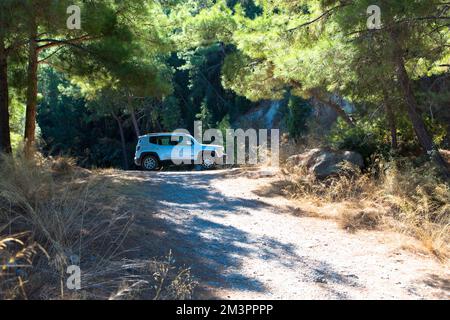 Vacation with a rental car. 4x4 off-road Jeep Renegade on dirt road on Rhodes island. Greece. October 09, 2022 Stock Photo