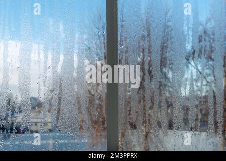 Heavily dewy or misty window during the frosty season Stock Photo