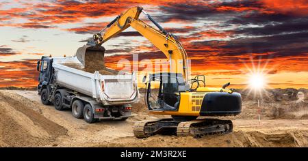 excavator ist working and digging at construction site Stock Photo