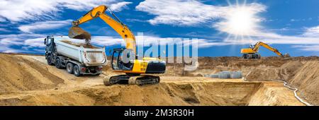 excavator ist working and digging at construction site Stock Photo