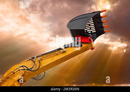 excavator ist working and digging at construction site Stock Photo