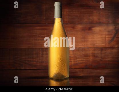 full wine bottle without label on wooden background Stock Photo