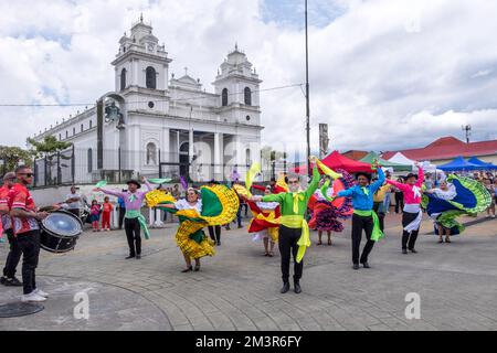 Folkloric group performing in front of the church of La Soledad in the historic center of the city of San José in Costa Rica Stock Photo