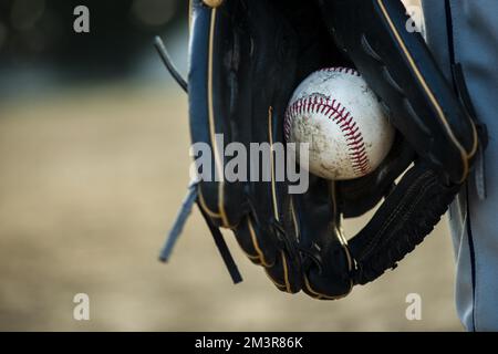 Close up baseball held glove Stock Photo