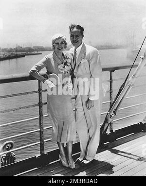 American actress Carole Lombard pictured on board a boat ready to set sail for Honolulu with her first husband, actor William Powell.  The pair were to divorce just two years later and Lombard would go on to marry Clark Gable.     Date: 1931 Stock Photo