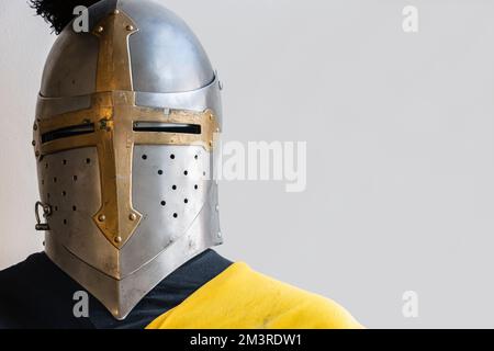 Armor of a medieval knight with a helmet with a feather Stock Photo - Alamy