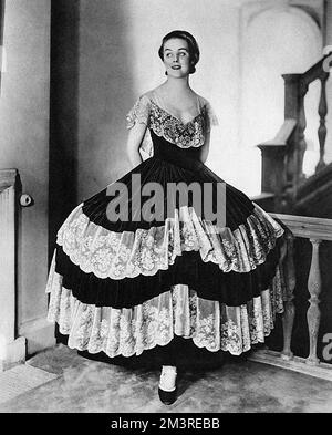 Mrs Bryan Guinness, formerly Diana Freeman-Mitford (1910 - 2003) and later Diana Mosley.  Pictured wearing a copy of the flounced lace crinoline worn by the actress Yvonne Printemps in the musical play, Mariette at His Majesty's Theatre.  1929 Stock Photo