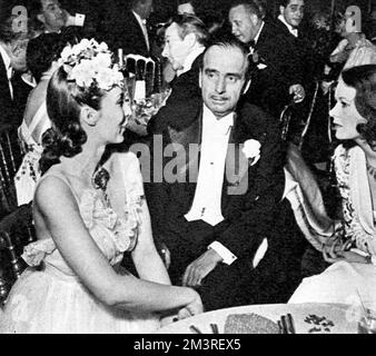 Douglas Fairbanks with his wife and Mme. Lopez de Sotomayor during the circus party held by Lady Mendl (Elsie de Wolfe) at Villa Trianon, her house in France.  1939 Stock Photo