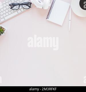 Workplace with various gadgets notebook coffee cup pink background. Resolution and high quality beautiful photo Stock Photo