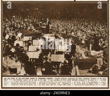 The Last Night of the Proms. Stanford Robinson conducting the BBC Symphony Orchestra at the Royal Albert Hall. The television camera can be seen on the right. It was recording the first outside television broadcast to be made in a concert hall.  1947 Stock Photo