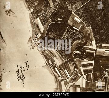Aerial photograph showing the breaching of the Eder Dam by the dambusters raid in May 1943 causing serious flooding through the Ruhr Valley.  Picture shows the village of Affoldern, two and a half miles downstream from the Eder Dam completely surrounded by flood water.  The power station was destroyed and electricity pylon isolated amidst the floods.       Date: 1943 Stock Photo