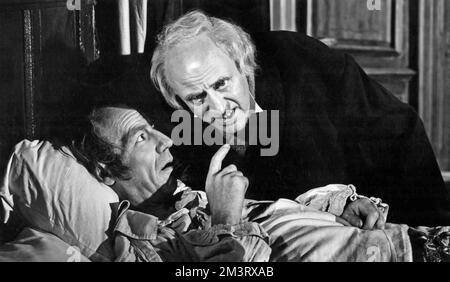 SCROOGE 1951 Renown Pictures film with Alastair Sim in the title role and  Michael Hordern as Jacob Marley's Ghost Stock Photo