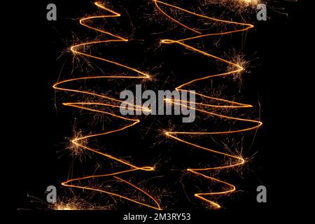 Lines and sparks of fireworks on a black background Stock Photo