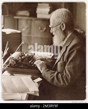 George Bernard Shaw (1856 - 1950), Irish playwright, critic, polemicist and political activist. Photograph showing Bernard Shaw at his typewriter when he was 82 years old. Stock Photo