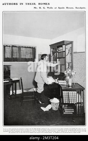 Herbert George Wells (1866 - 1946), writer, historian, best known for his science fiction novels. Pictured in his study at his home, Spade House, Sandgate, part of a long running series in The Tatler showing well known writers in their homes. Stock Photo