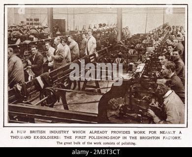A pilot scheme was started in spring 1917 by Mr. Bernard Oppenheimer, a diamond merchant. The factory provided training for thousands of wounded ex-soldiers and sailors during and after World War One. Photograph showing men working in the works in Brighton, cutting and polishing diamonds. Stock Photo