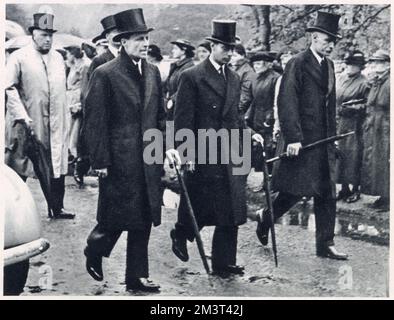 King George VI following the coffin of his mother-in-law, the Countess of Strathmore, together with the countess's sons, Lord Glamis and David Bowes-Lyon, as her funeral cortege left Glamis Castle on 27 June 1938. Stock Photo