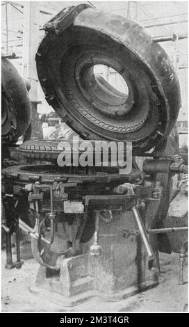 The original tyre factory for Dunlop Tyres at Fort Dunlop in the Erdington district of Birmingham. One of the methods of curing a tyre. The mould is open and the cured tyre is seen between the two halves. Stock Photo