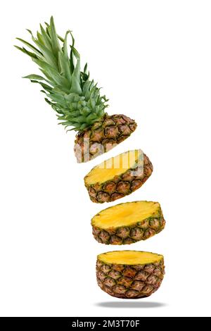 Flying fresh ripe pineapple slices isolated on a white background Stock Photo