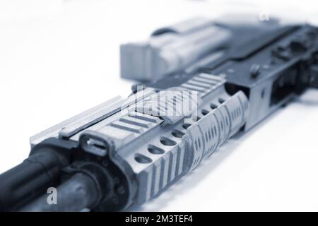 3D printed weapon parts. Assembly of weapons rifle, some parts printed on 3D printer. Details of gray color of weapon printed on 3D printer from polyamide powder. Progressive additive technology Stock Photo